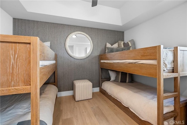 112 30th St, Newport Beach, CA 92663 - bedroom featuring wallpapered walls, wood finished floors, an accent wall, and ceiling fan