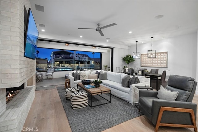 112 30th St, Newport Beach, CA 92663 - living area featuring a ceiling fan, wood finished floors, recessed lighting, and a fireplace