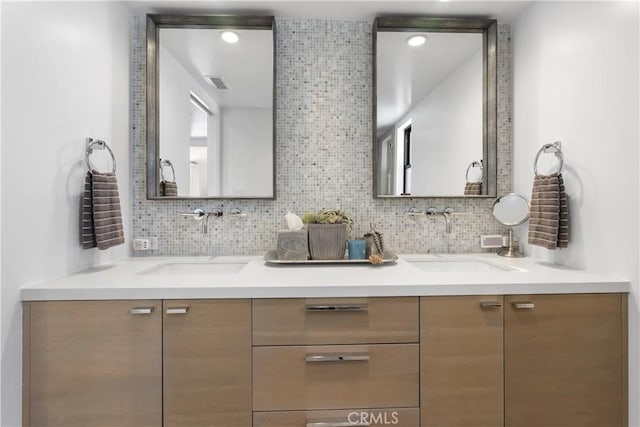 112 30th St, Newport Beach, CA 92663 - bathroom featuring double vanity and tasteful backsplash