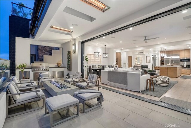 112 30th St, Newport Beach, CA 92663 - view of patio / terrace featuring exterior kitchen, an outdoor living space with a fire pit, and a ceiling fan