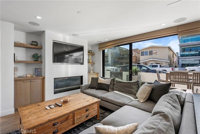 112 30th St, Newport Beach, CA 92663 - living area with a glass covered fireplace, wood finished floors, and recessed lighting