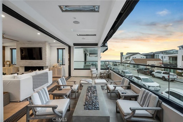 112 30th St, Newport Beach, CA 92663 - balcony at dusk with an outdoor living space