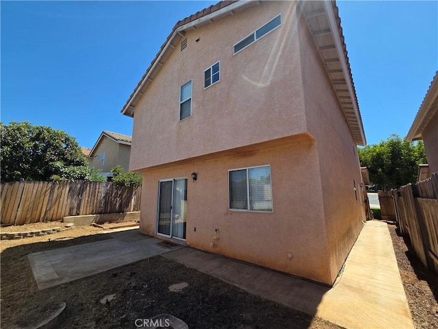 1315 Navello, El Cajon, CA 92021 - rear view of property with stucco siding, a fenced backyard, a patio area, and a tile roof