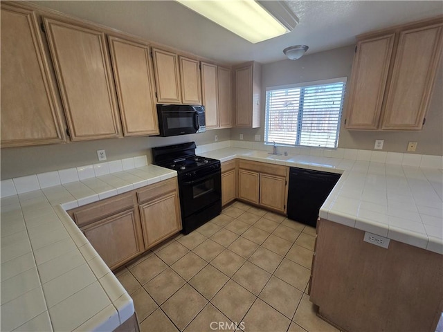 1315 Navello, El Cajon, CA 92021 - kitchen featuring black appliances, light tile patterned floors, light brown cabinets, and tile counters