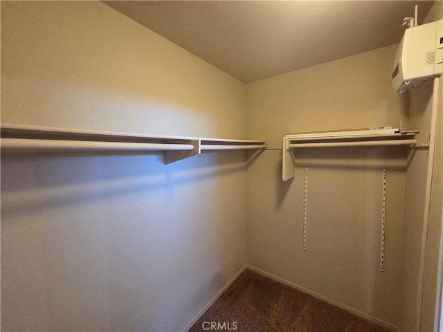 1315 Navello, El Cajon, CA 92021 - walk in closet featuring dark carpet, vaulted ceiling, and a wall unit AC