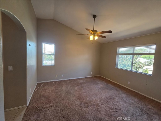 1315 Navello, El Cajon, CA 92021 - empty room with arched walkways, plenty of natural light, lofted ceiling, a ceiling fan, and light carpet