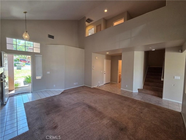 1315 Navello, El Cajon, CA 92021 - unfurnished living room featuring light tile patterned flooring, high vaulted ceiling, stairway, recessed lighting, and light colored carpet
