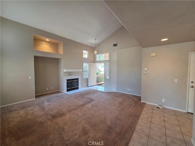 1315 Navello, El Cajon, CA 92021 - unfurnished living room featuring high vaulted ceiling, light tile patterned floors, a tile fireplace, light colored carpet, and recessed lighting
