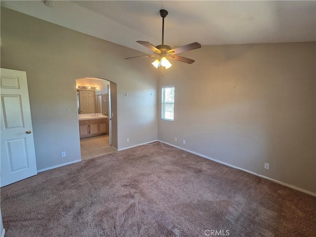 1315 Navello, El Cajon, CA 92021 - empty room with ceiling fan, arched walkways, light carpet, and lofted ceiling