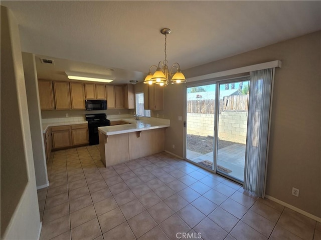 1315 Navello, El Cajon, CA 92021 - kitchen featuring black appliances, a peninsula, light countertops, a chandelier, and light tile patterned floors
