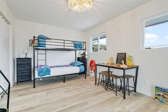 31 N 3rd St, Cayucos, CA 93430 - bedroom featuring wood finished floors and a chandelier