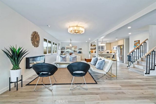 31 N 3rd St, Cayucos, CA 93430 - living room featuring a chandelier, light wood-type flooring, stairs, and recessed lighting