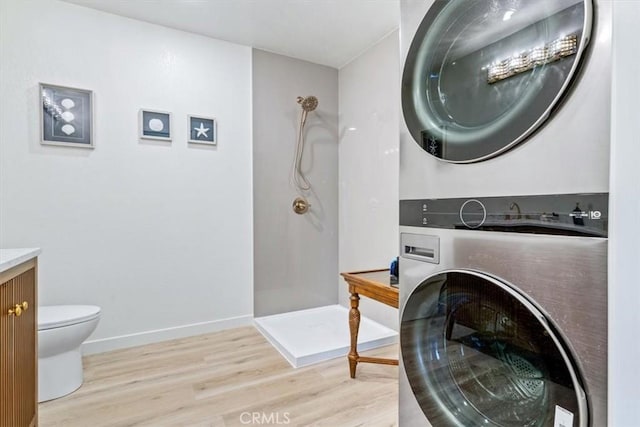 31 N 3rd St, Cayucos, CA 93430 - washroom featuring stacked washer / drying machine and light wood-style floors