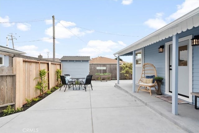 31 N 3rd St, Cayucos, CA 93430 - fenced backyard with outdoor dining area, a storage shed, and a patio area