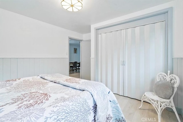 31 N 3rd St, Cayucos, CA 93430 - bedroom featuring light wood-style floors, wainscoting, and a closet