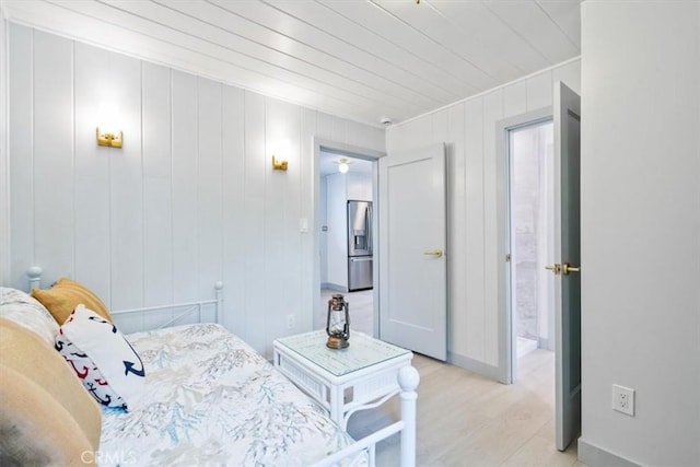 31 N 3rd St, Cayucos, CA 93430 - bedroom featuring stainless steel fridge with ice dispenser, crown molding, and light wood-style flooring