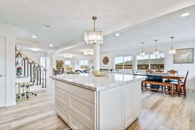 31 N 3rd St, Cayucos, CA 93430 - kitchen featuring light wood finished floors, a chandelier, white cabinetry, light stone counters, and recessed lighting