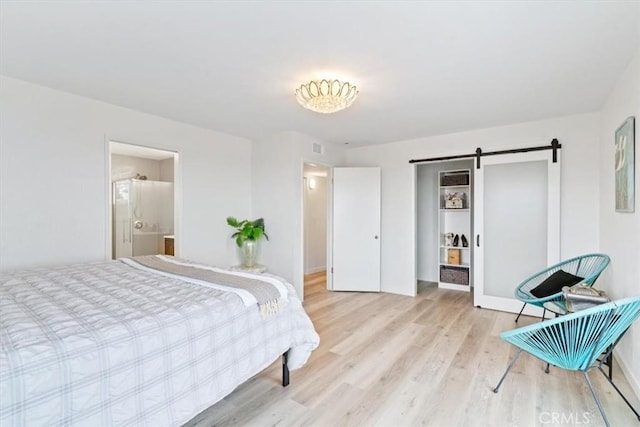 31 N 3rd St, Cayucos, CA 93430 - bedroom featuring wood finished floors, a barn door, and freestanding refrigerator