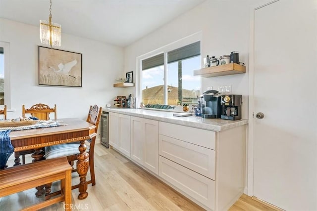 31 N 3rd St, Cayucos, CA 93430 - dining room with beverage cooler and light wood-style floors