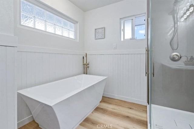 31 N 3rd St, Cayucos, CA 93430 - bathroom with a wainscoted wall, plenty of natural light, a stall shower, and wood finished floors