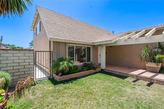14652 Devonshire Ave, Tustin, CA 92780 - view of exterior entry with a shingled roof and a gate