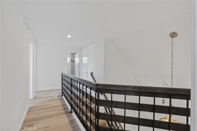 14652 Devonshire Ave, Tustin, CA 92780 - corridor with light wood-style floors, recessed lighting, and an upstairs landing