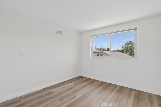 14652 Devonshire Ave, Tustin, CA 92780 - unfurnished room with light wood-style floors and baseboards