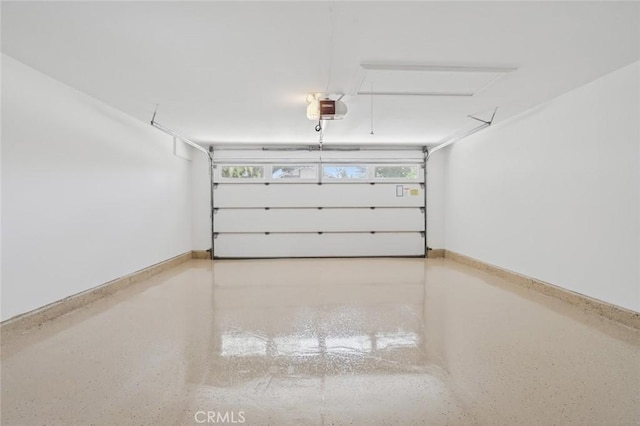 14652 Devonshire Ave, Tustin, CA 92780 - garage featuring a garage door opener and baseboards