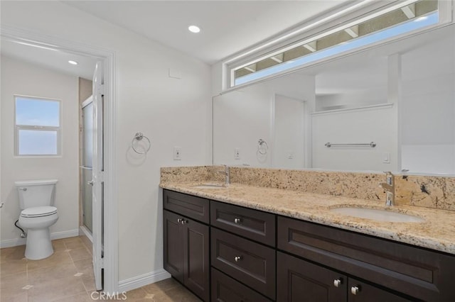 14652 Devonshire Ave, Tustin, CA 92780 - bathroom with double vanity, a shower stall, healthy amount of natural light, tile patterned floors, and recessed lighting