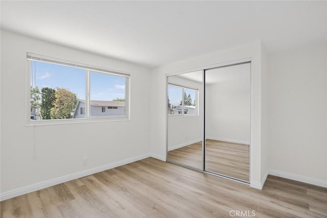 14652 Devonshire Ave, Tustin, CA 92780 - unfurnished bedroom featuring wood finished floors and a closet