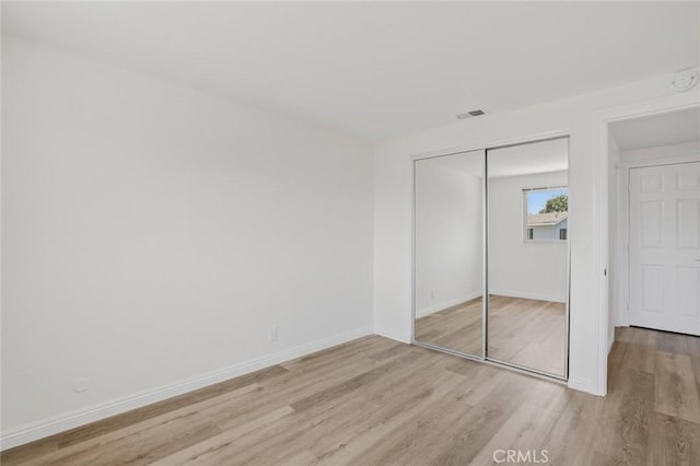 14652 Devonshire Ave, Tustin, CA 92780 - unfurnished bedroom featuring light wood-style flooring and a closet