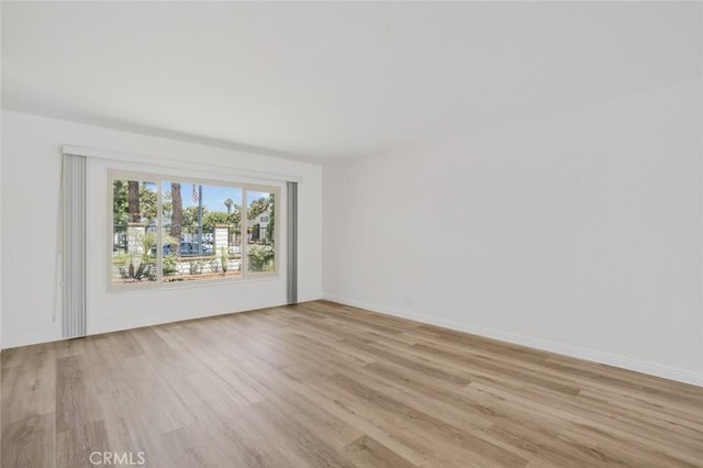 14652 Devonshire Ave, Tustin, CA 92780 - empty room with light wood-style flooring and baseboards