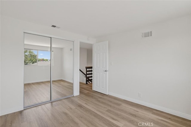 14652 Devonshire Ave, Tustin, CA 92780 - unfurnished bedroom with wood finished floors and a closet