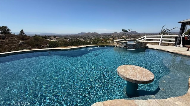 40107 Calle Breve, Temecula, CA 92592 - view of swimming pool with a pool with connected hot tub and a mountain view