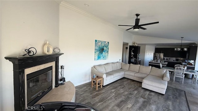 40107 Calle Breve, Temecula, CA 92592 - living room with crown molding, ceiling fan, a fireplace, and dark wood finished floors