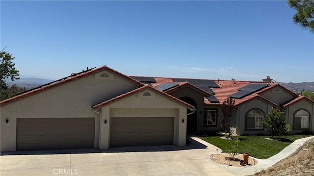 40107 Calle Breve, Temecula, CA 92592 - mediterranean / spanish home with stucco siding, driveway, an attached garage, and a front yard