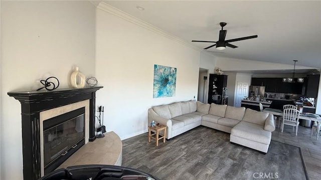 40107 Calle Breve, Temecula, CA 92592 - living room featuring ornamental molding, a ceiling fan, a high end fireplace, and dark wood finished floors