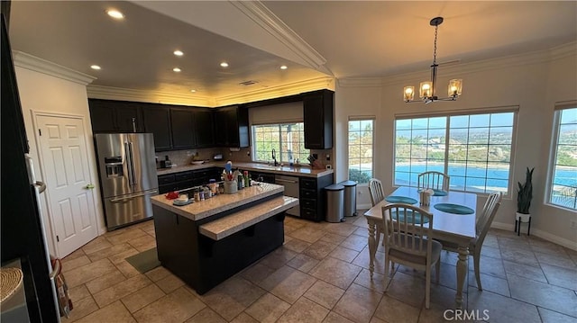 40107 Calle Breve, Temecula, CA 92592 - kitchen featuring high quality fridge, crown molding, recessed lighting, a chandelier, and light countertops