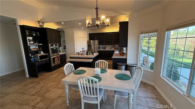 40107 Calle Breve, Temecula, CA 92592 - dining area with stone tile flooring, a chandelier, and crown molding