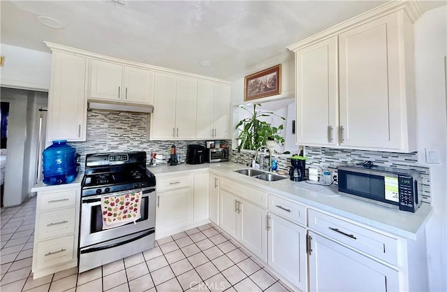 11425 Hayford St, Norwalk, CA 90650 - kitchen with stainless steel appliances, tasteful backsplash, and light countertops