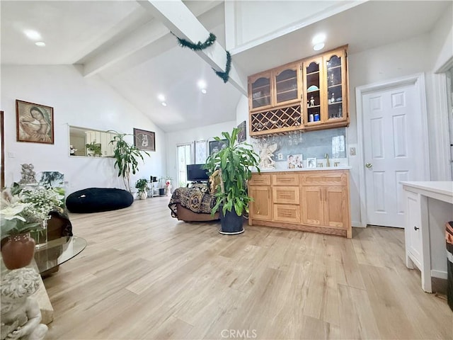 11425 Hayford St, Norwalk, CA 90650 - indoor wet bar with beam ceiling, light wood finished floors, recessed lighting, tasteful backsplash, and high vaulted ceiling