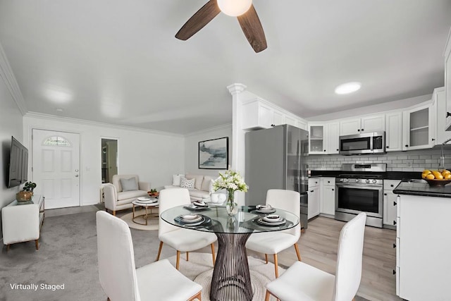 190 Avenida Descanso Unit I, Oceanside, CA 92057 - dining room with ornamental molding, ceiling fan, and light wood-style floors