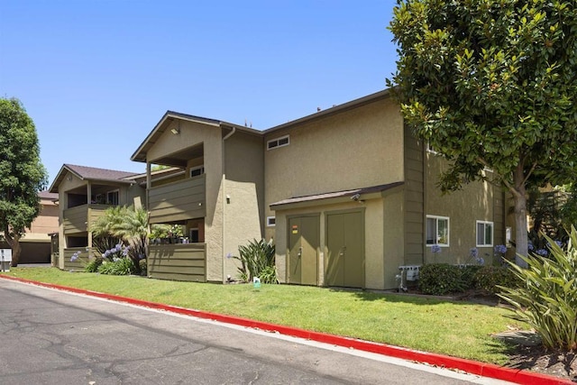 190 Avenida Descanso Unit I, Oceanside, CA 92057 - view of front of house with stucco siding and a front lawn