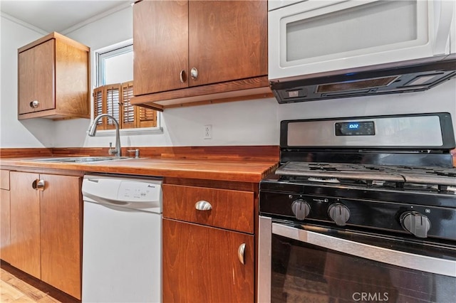4136 Eileen St, Riverside, CA 92504 - kitchen with white appliances, wood counters, and light wood finished floors