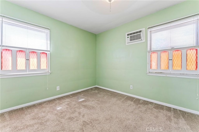 4136 Eileen St, Riverside, CA 92504 - carpeted spare room with an AC wall unit and baseboards