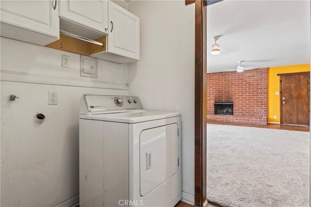 4136 Eileen St, Riverside, CA 92504 - washroom with washer / clothes dryer, cabinet space, a brick fireplace, and light carpet