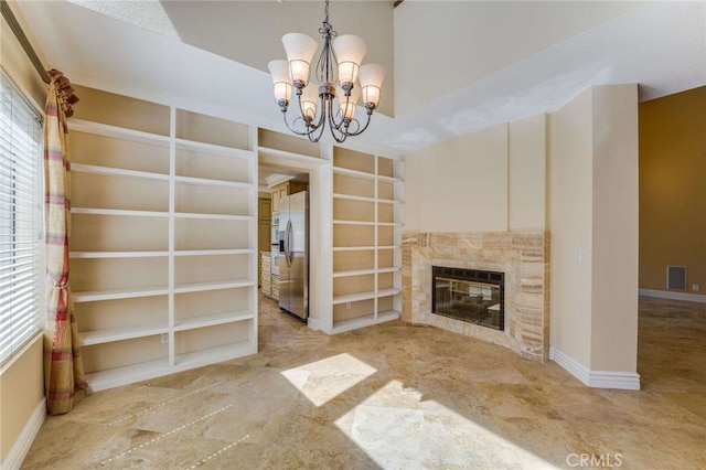 24961 Beachwalk Way, Dana Point, CA 92629 - unfurnished living room with a chandelier, a glass covered fireplace, and built in features