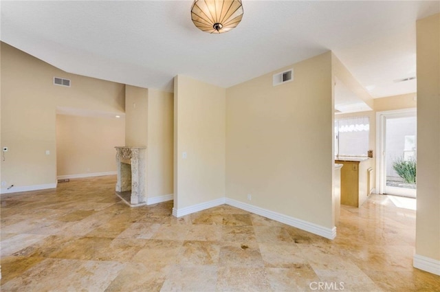 24961 Beachwalk Way, Dana Point, CA 92629 - unfurnished room featuring a fireplace and vaulted ceiling