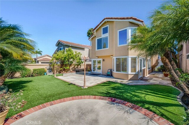 24961 Beachwalk Way, Dana Point, CA 92629 - back of house with stucco siding, a patio, a fenced backyard, and a tiled roof