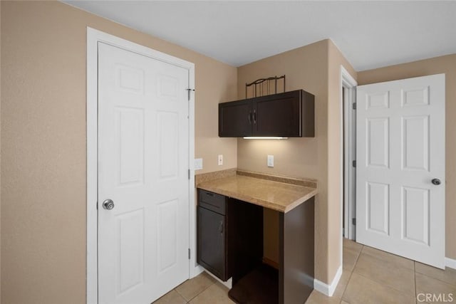 1756 6th St, Los Osos, CA 93402 - kitchen with light tile patterned floors and dark brown cabinets